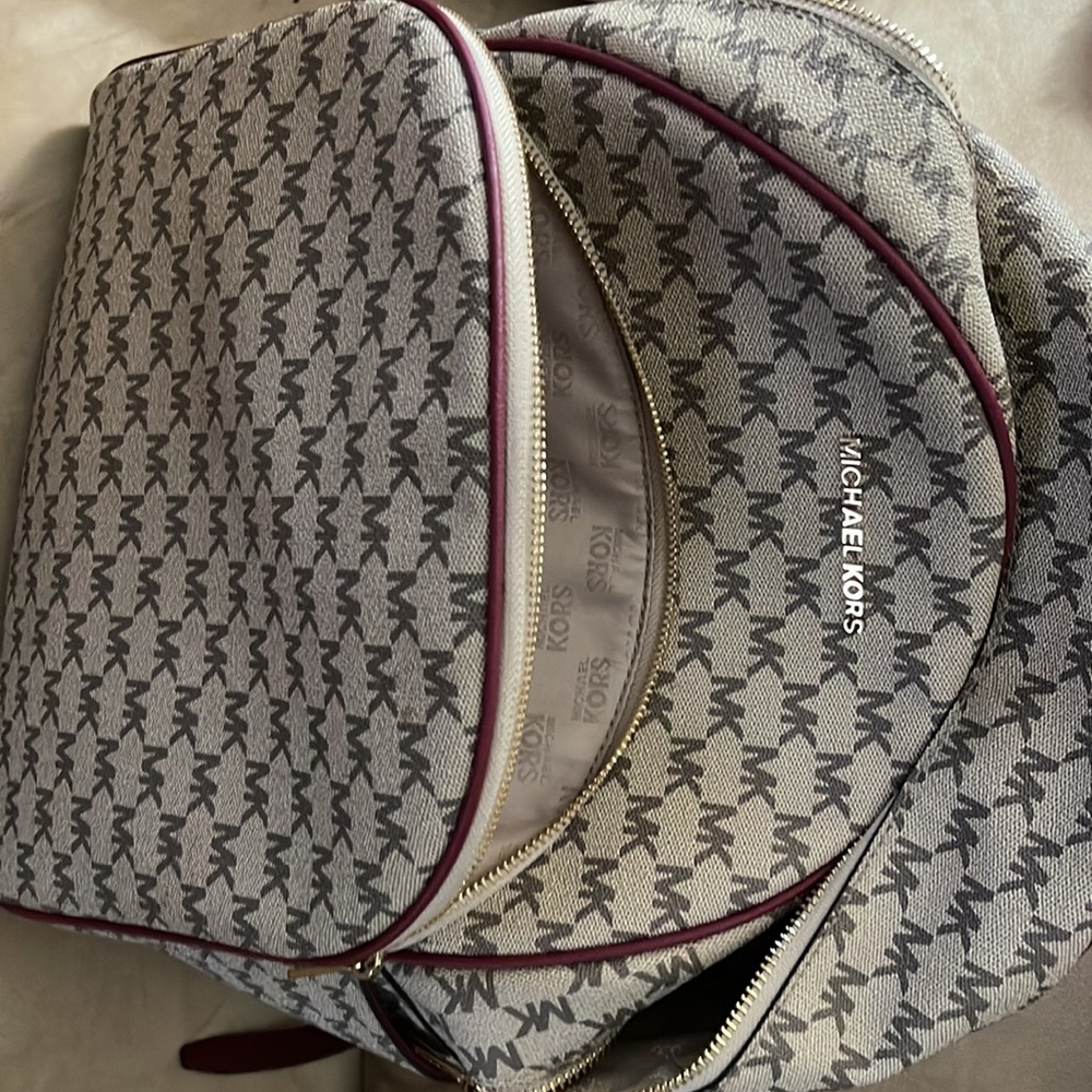 Michael Kors backpack a regular sized. Tan & burgundy with all the zippers. - Picture 4 of 8